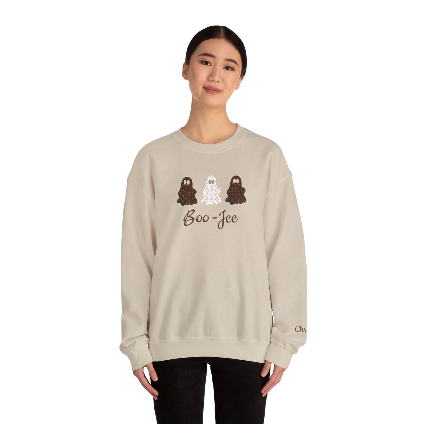 Person wearing a beige sweatshirt with 'Boo-Jee' design on a white background