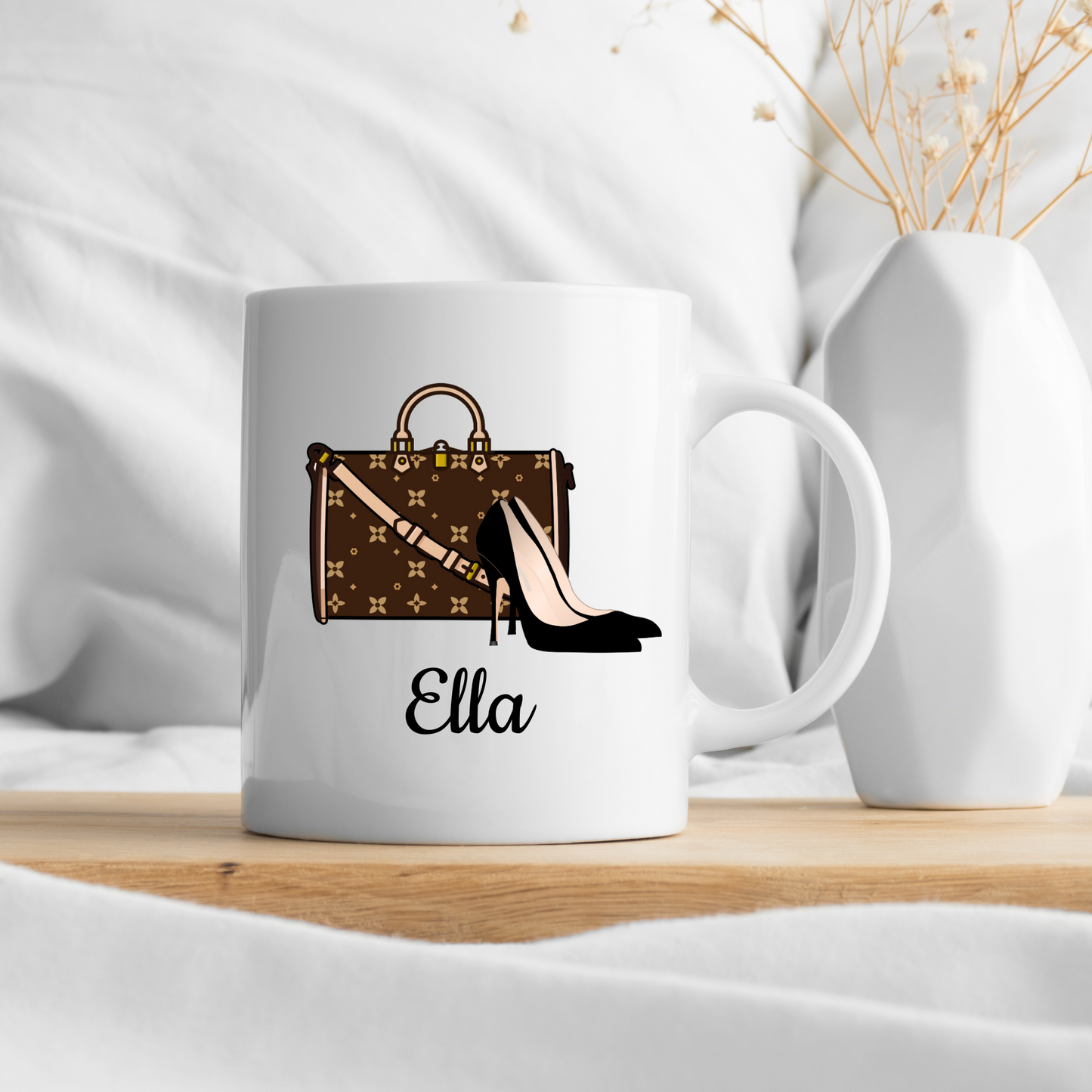 White mug with a brown handbag and black high heel design, featuring the name 'Ella', on a white background.