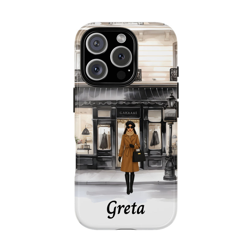 Phone case with a design of a woman in a coat walking past a store, with 'Greta' text.