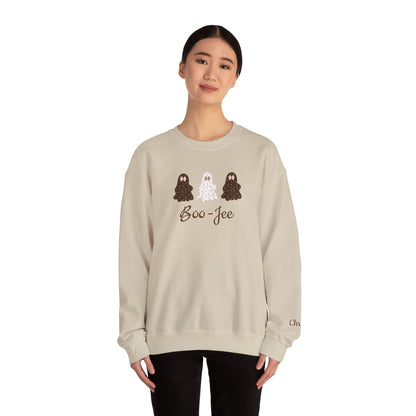 Person wearing a beige sweatshirt with 'Boo-Jee' design on a white background