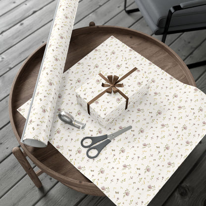 Petits Animaux floral-patterned gift wrap with scissors on a wooden surface