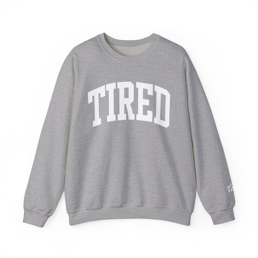 Gray sweatshirt with 'TIRED' text on a white background