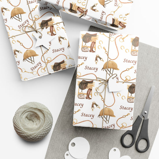 Personalized equestrian wrapping paper featuring watercolor saddles, boots, and bridles, printed on satin-finish paper from Trésor Valeur’s Modern Equestrian Collection