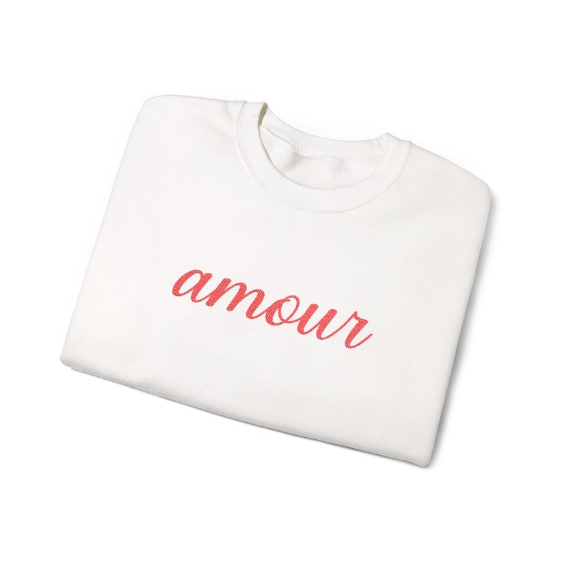 White sweatshirt with 'amour' printed in red on a white background