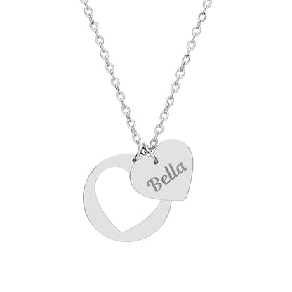 Silver necklace with a heart-shaped pendant and engraved name on a white background