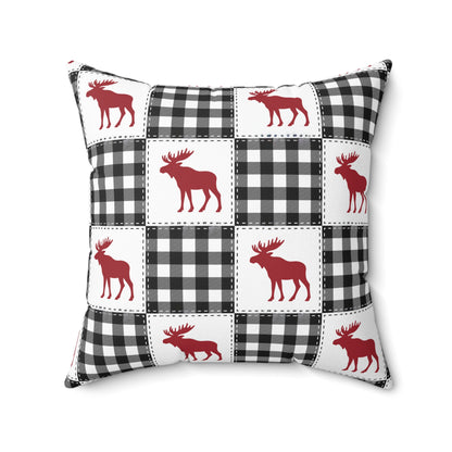 Pillow with red moose and black and white checkered pattern on a white background