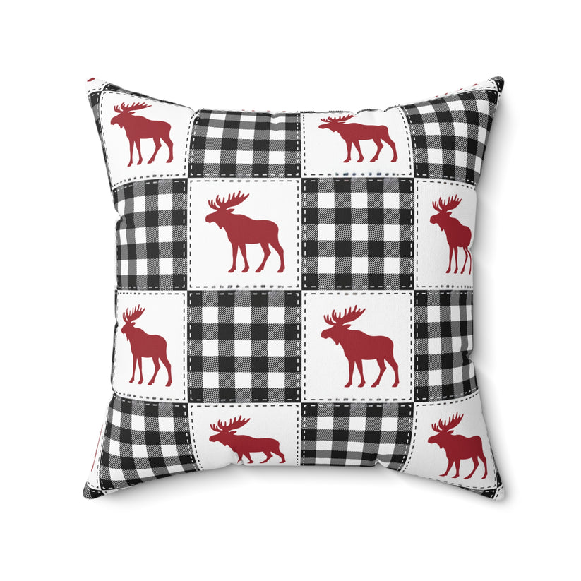 Pillow with red moose and black and white checkered pattern on a white background