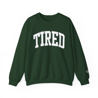 Green sweatshirt with 'TIRED' text on a white background