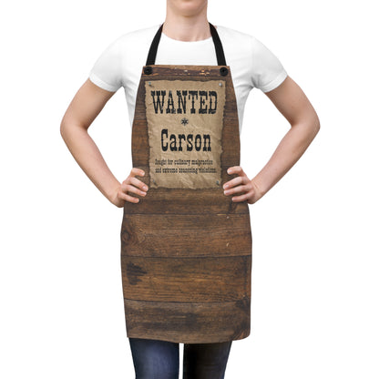 Person wearing a wooden apron with 'Wanted Carson' design on a white background