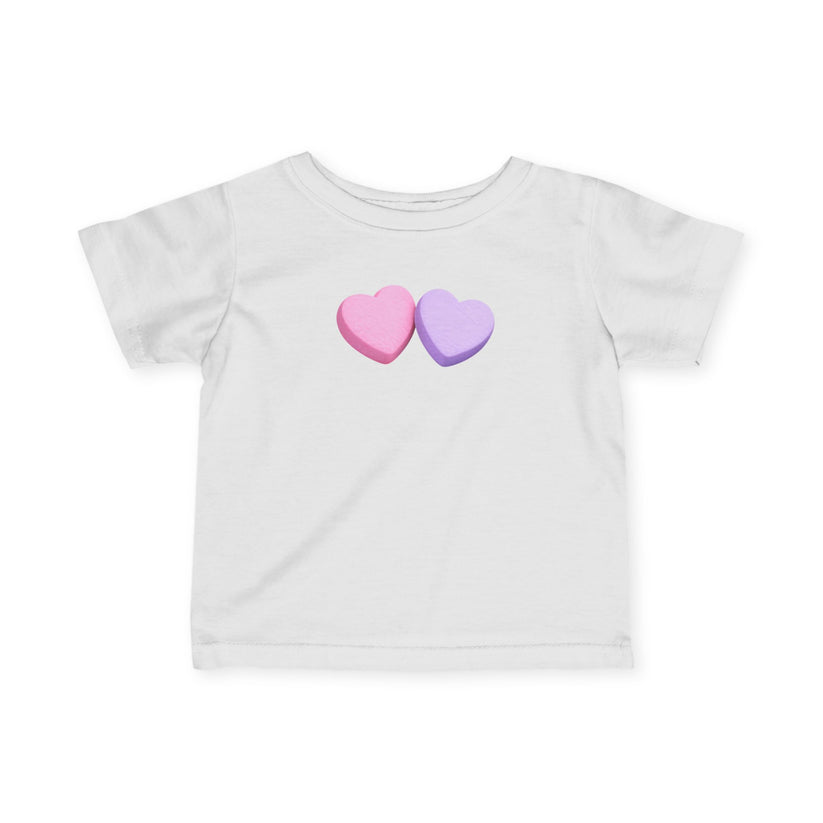 White t-shirt with pink and purple heart designs on a white background