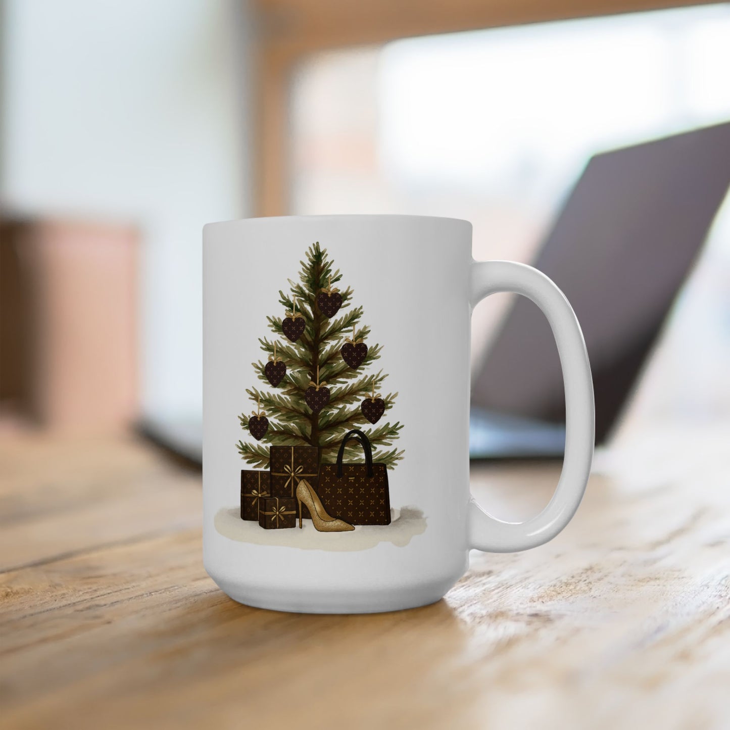 White mug with a Christmas tree and gift design on a wooden surface.