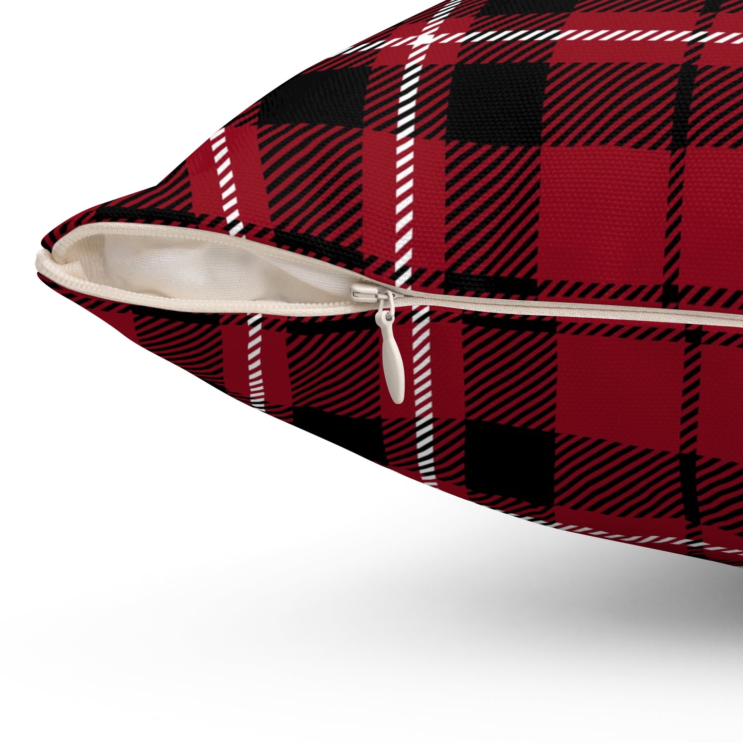 Red and black plaid pillow with a zipper on a white background