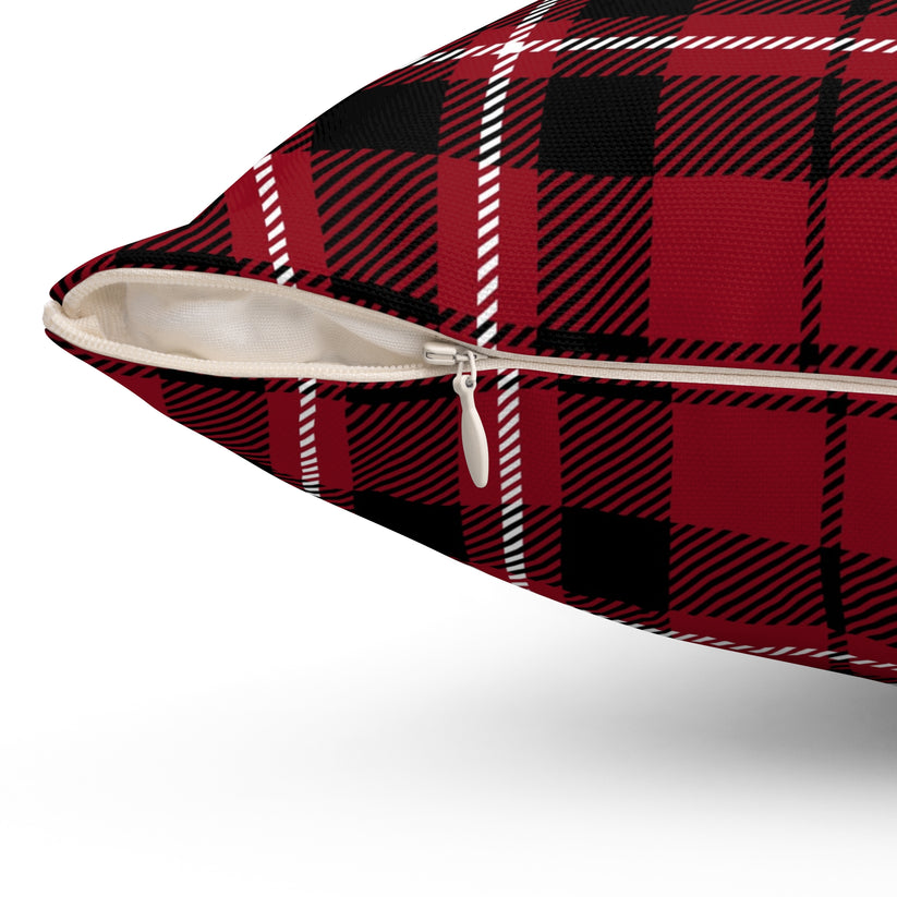 Red and black plaid pillow with a zipper on a white background