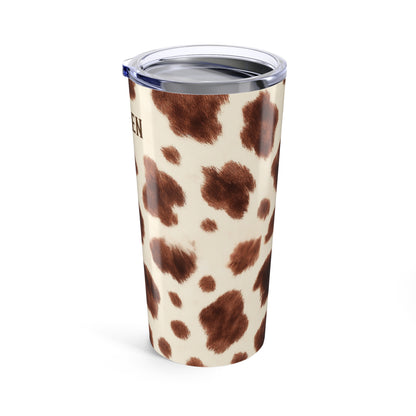 Tumbler with cow print design on a white background