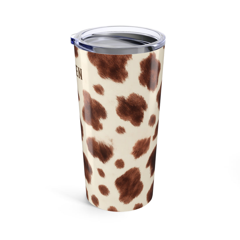 Tumbler with cow print design on a white background