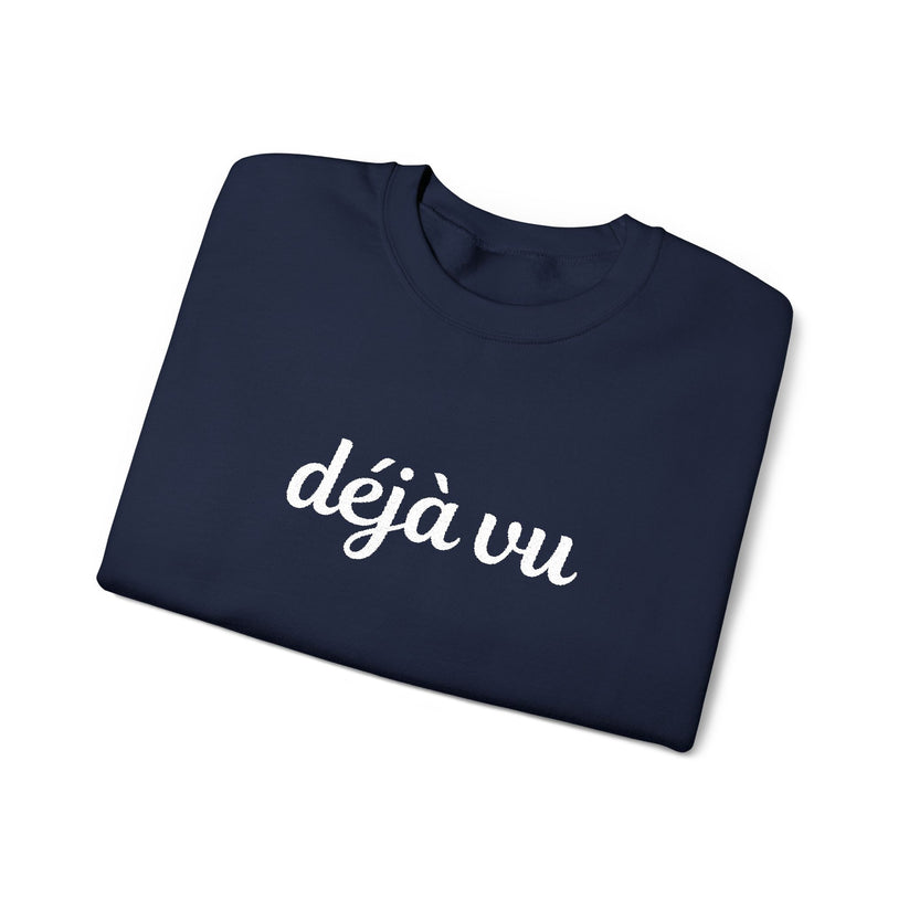 Navy blue sweatshirt with 'déjà vu' embroidered text on a white background