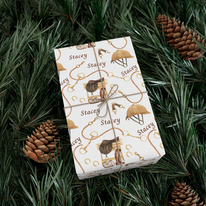 Personalized equestrian wrapping paper featuring watercolor saddles, boots, and bridles, printed on satin-finish paper from Trésor Valeur’s Modern Equestrian Collection