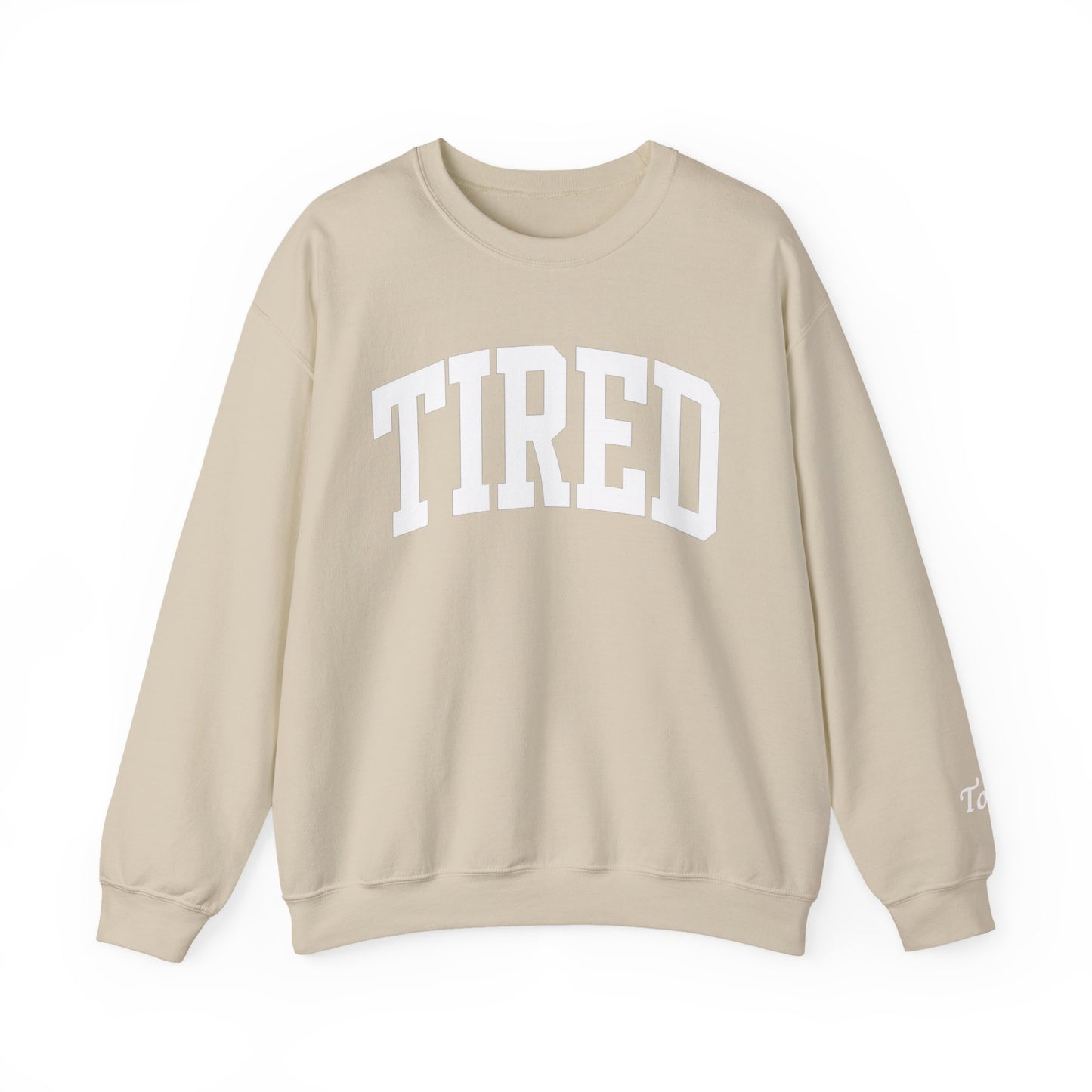 Beige sweatshirt with 'TIRED' text on a white background