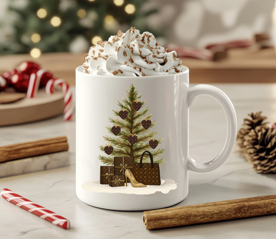 White mug with Christmas tree and gift design, filled with hot chocolate and whipped cream, on a festive background.