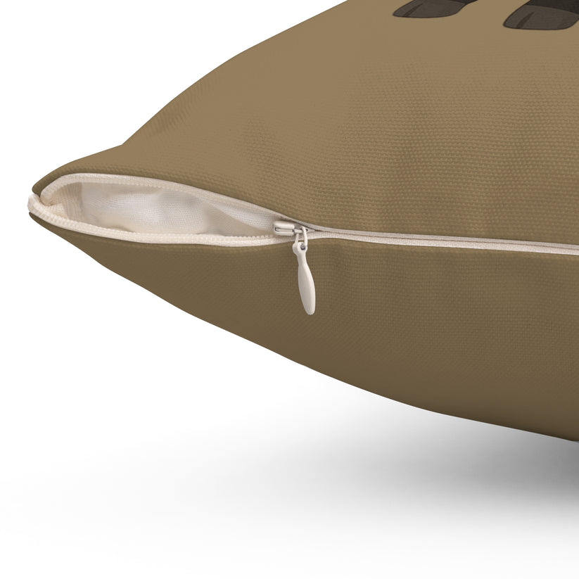 Brown pillow with a zipper on a white background