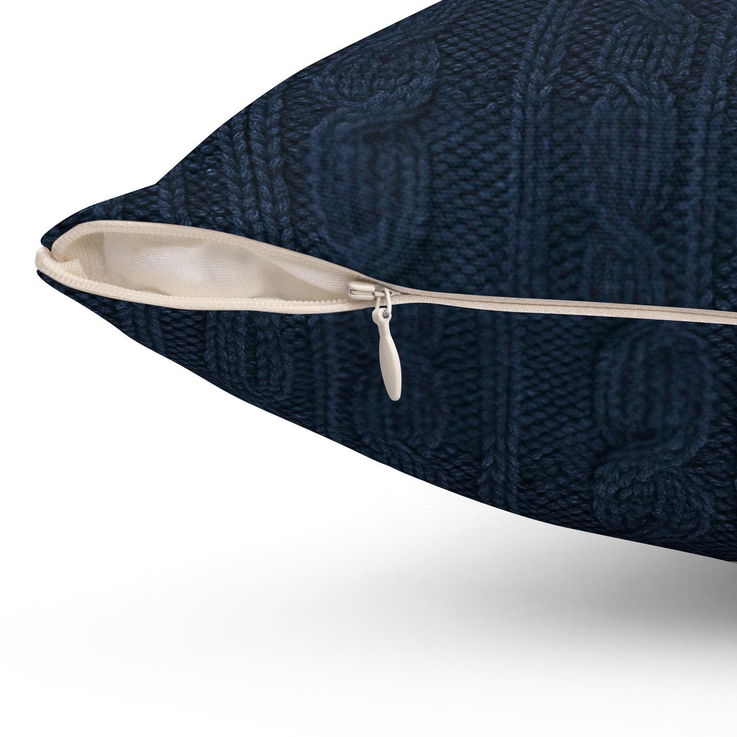 Navy blue textured pillow with a zipper on a white background