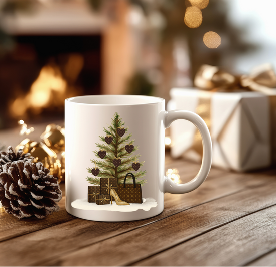 White mug with Christmas tree design on a wooden table with festive background