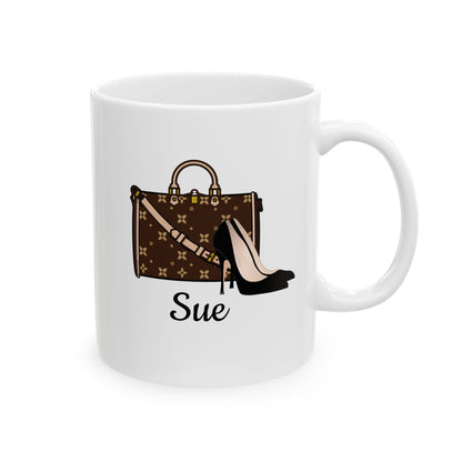 White mug with a brown handbag and black high heel shoe design, featuring the name 'Sue'.