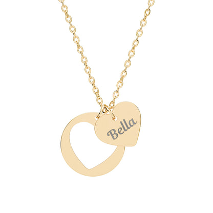 Gold necklace with a heart-shaped pendant and 'Bella' engraving on a white background