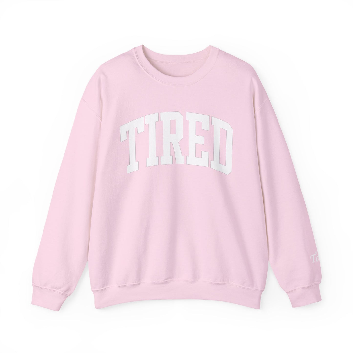 Pink sweatshirt with 'TIRED' text on a white background