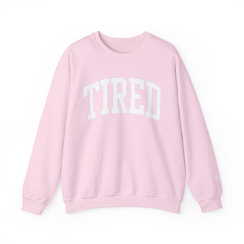 Pink sweatshirt with 'TIRED' text on a white background
