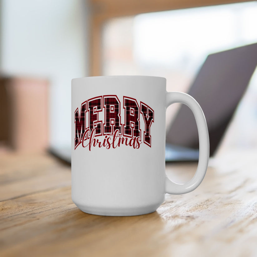 White mug with 'Merry Christmas' text on a wooden surface