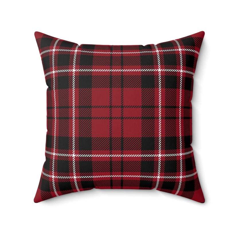 Red and black plaid pillow on a white background