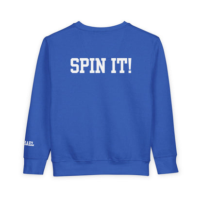 Blue sweatshirt with 'SPIN IT!' text on a white background