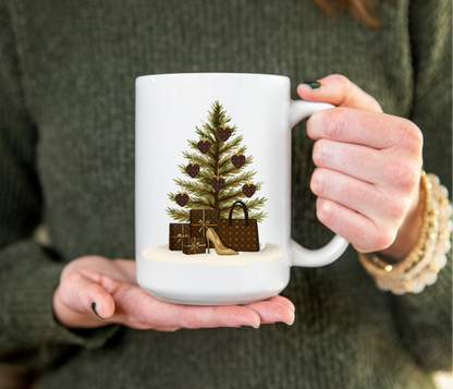 Person holding a mug with a Christmas tree and gift design.