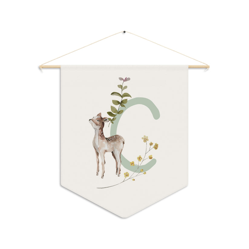 Decorative banner with a deer and letter 'C' design on a white background
