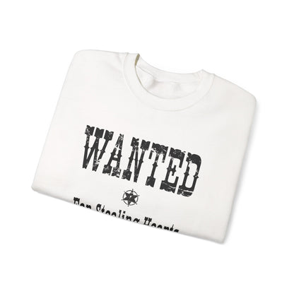 White sweatshirt with 'WANTED' text on a white background