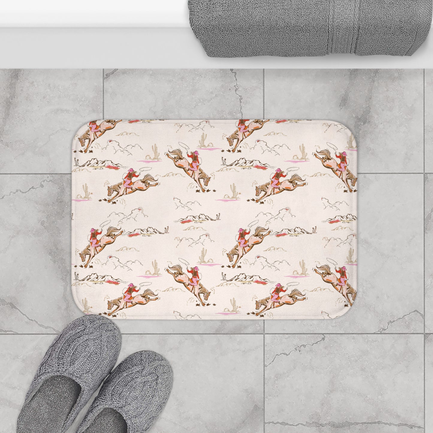 Patterned bath mat with horse and rider design on a tiled floor.