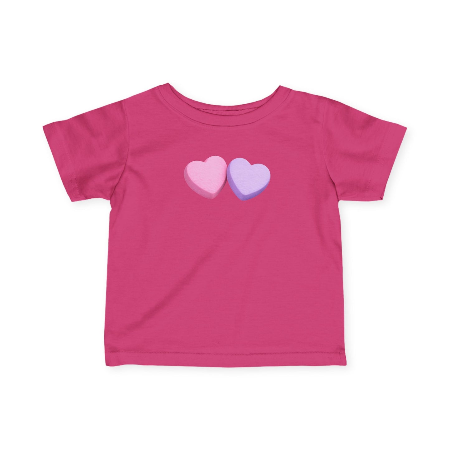 Pink t-shirt with two heart-shaped candies on a white background