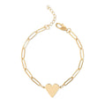 Gold bracelet with a heart charm on a white background