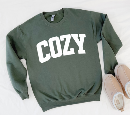 Green sweatshirt with 'COZY' text on a white background