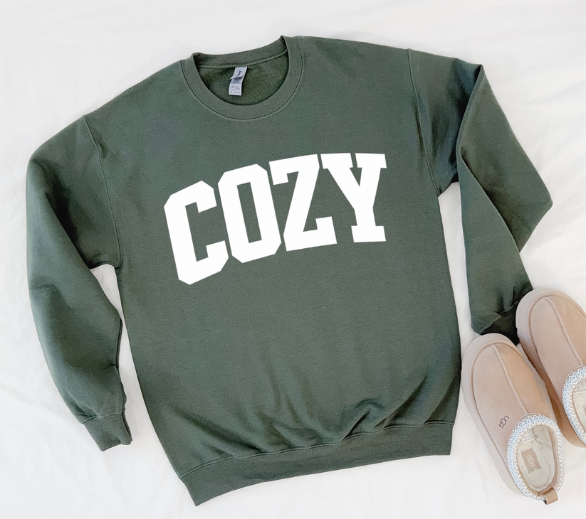 Green sweatshirt with 'COZY' text on a white background