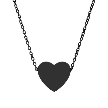 Black heart-shaped pendant on a chain against a white background