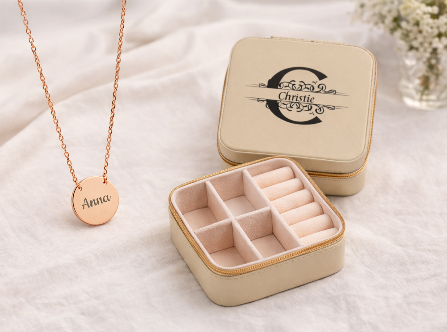 Rose gold necklace with a name pendant in a jewelry box on a white background
