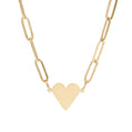 Gold heart-shaped pendant on a gold chain against a white background