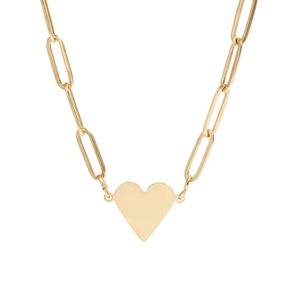Gold heart-shaped pendant on a gold chain against a white background