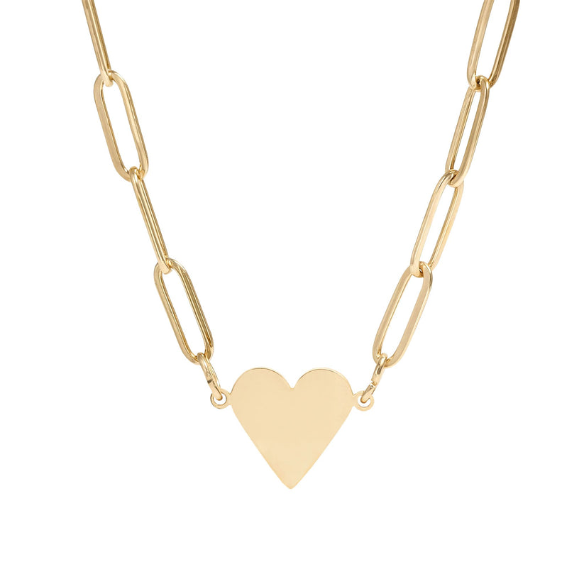 Gold heart-shaped pendant on a gold chain against a white background