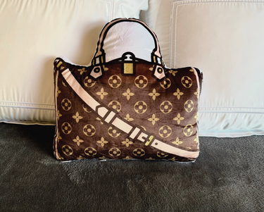 Fun fashion pillow in the shape of a classic handbag.