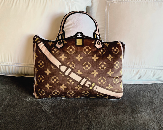 Fun fashion pillow in the shape of a classic handbag.