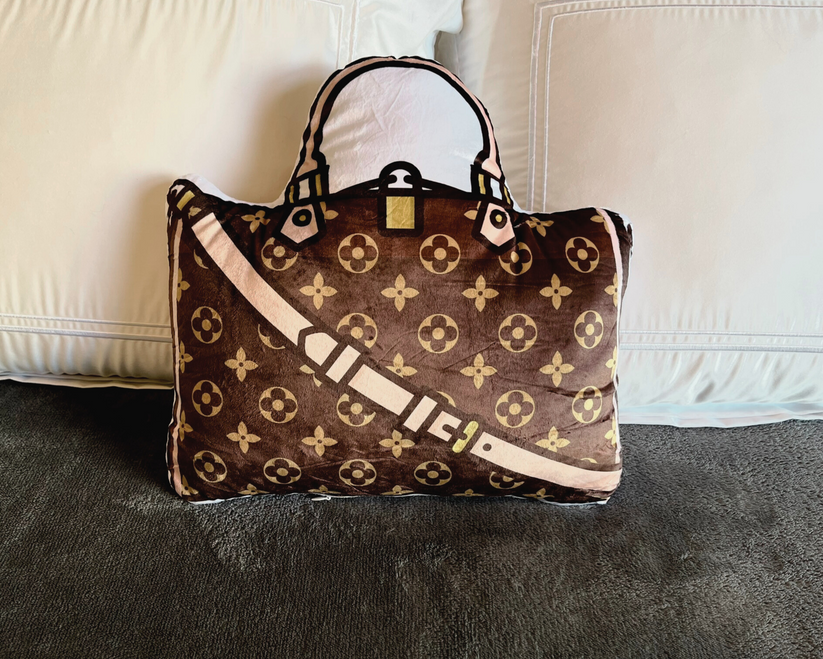 Fun fashion pillow in the shape of a classic handbag.