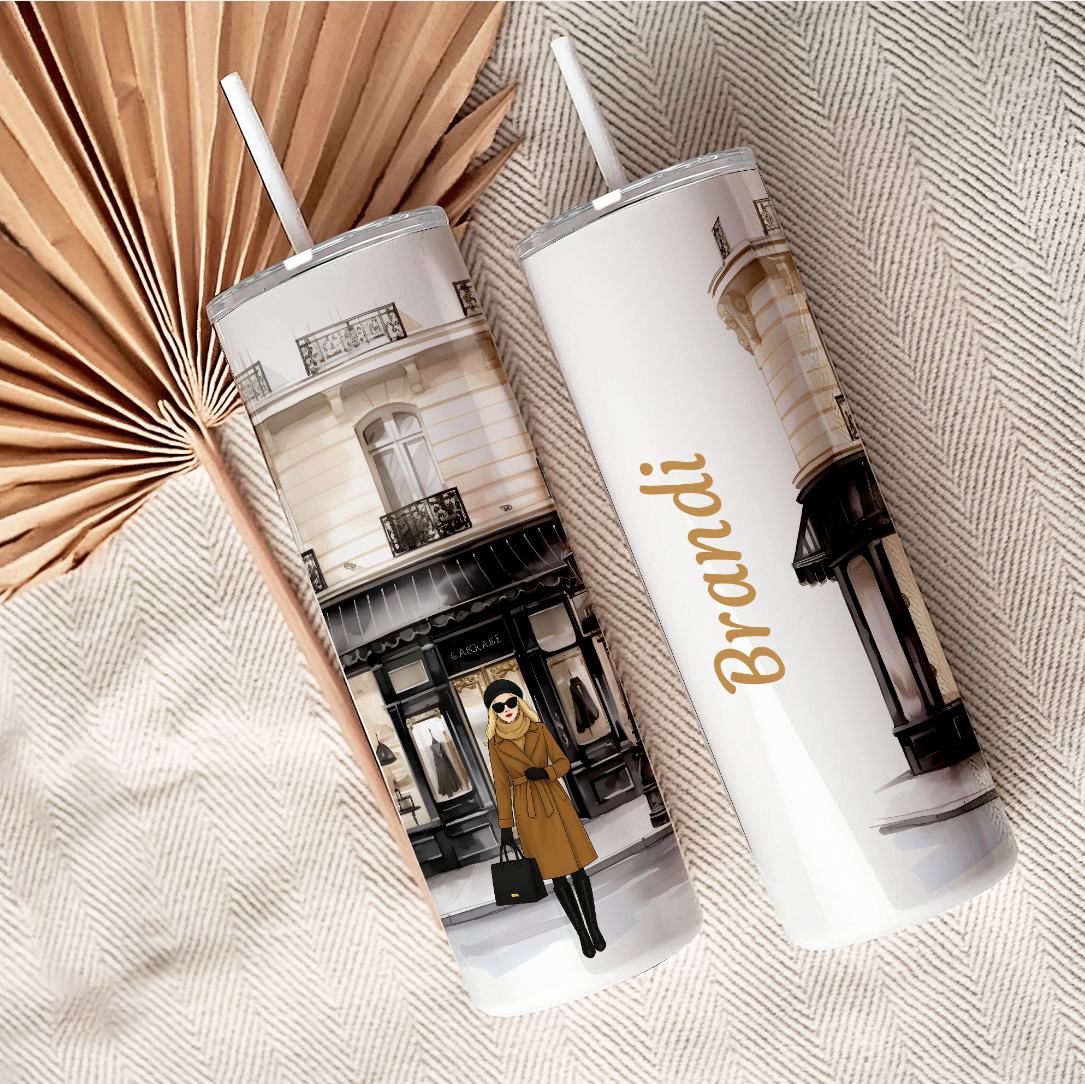 Two tumblers with a boutique design showing the full wrap.  Personalized with an avatar and name.